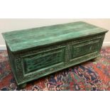 WITHDRAWN A modern Indian carved and green painted hardwood coffer,