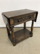 An oak single drawer drop leaf side table attributed to Titchmarsh & Goodwin,