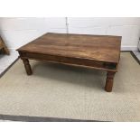 A modern Indian hardwood coffee table with wrought iron decoration 135 cm long x 84 cm wide x 46 cm