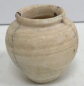 A small Egyptian alabaster vase (cracked) circa 2000 B.C., 6.