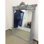 A modern grey painted and carved framed overmantel mirror in the 19th Century taste, 137.