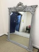 A modern grey painted and carved framed overmantel mirror in the 19th Century taste, 137.