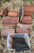 A collection of nineteen various ridge tiles together with other tiles including slates etc,