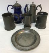 A collection of various pewter wares to include Victorian quart mug,