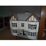 A modern dolls house "Fairbanks" as a double fronted bay windowed townhouse with garden to rear,