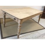 A late Victorian scrubbed pine farmhouse style kitchen table,
