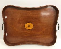 An Edwardian mahogany shaped rectangular two handled drinks tray,