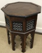 A Syrian mother of pearl and bone inlaid teak octagonal occasional table with fretwork carved