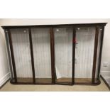 A Victorian glazed cabinet with two pairs of doors and bowed end panels 213 cm wide over all x 26