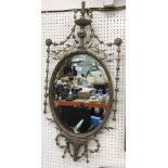 A gilt framed oval wall mirror in the Regency style with harebell and foliate open work decoration