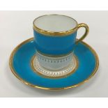 A Mintons bleu celeste and gilt decorated coffee set comprising fifteen cups and thirteen saucers