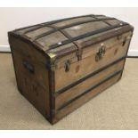 A 19th Century French strap work decorated studded leather bound canvas covered dome top trunk,