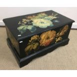 A modern black lacquered and chinoiserie decorated side cabinet with single drawer over two