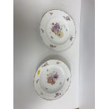 A pair of 19th Century Copenhagen porcelain floral spray and gilt decorated plates with basket work
