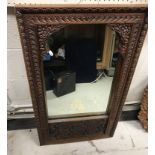 Four various Middle Eastern carved teak framed wall mirrors