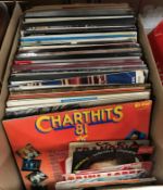 A box of assorted records to include mainly Classical LPs as well as various singles to include Hot