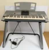 A Yamaha PSR 3000 keyboard on stand