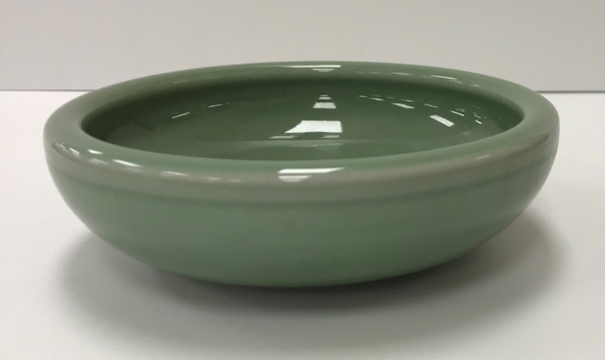 A Royal Copenhagen celadon glazed bowl of plain form raised on a shallow circular foot bearing blue - Image 3 of 3