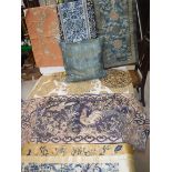 A collection of various Oriental textiles to include a Chinese panel,