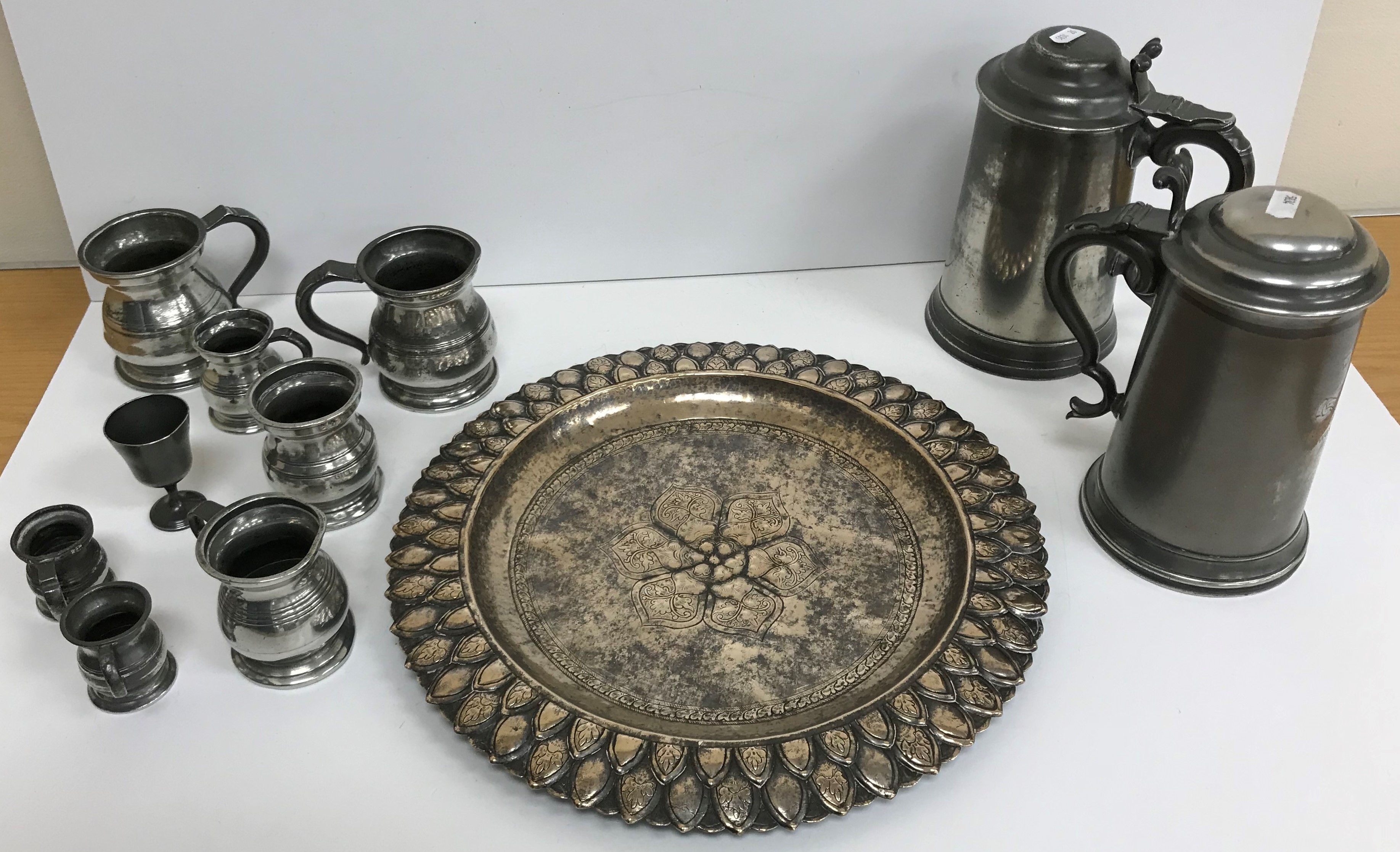 A collection of seven 19th Century pewter baluster shaped measures,