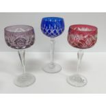 A collection of overlaid cut glass hocks, including six pineapple cut blue overlaid,