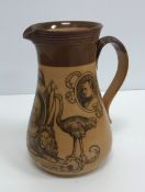 A Doulton Lambeth stoneware jug "South Africa 1900" decorated with figures and symbols of the