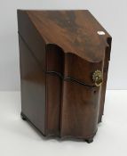 A George III figured mahogany serpentine fronted slope top knife box,