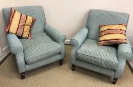 A pair of modern upholstered scroll armchairs in the Howard style with blue striped upholstery