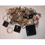 A collection of costume jewellery to include various bangles, bead necklaces,