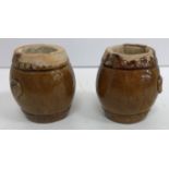 A pair of Chinese treacle glazed pottery miniature barrel shaped garden seats, 7.