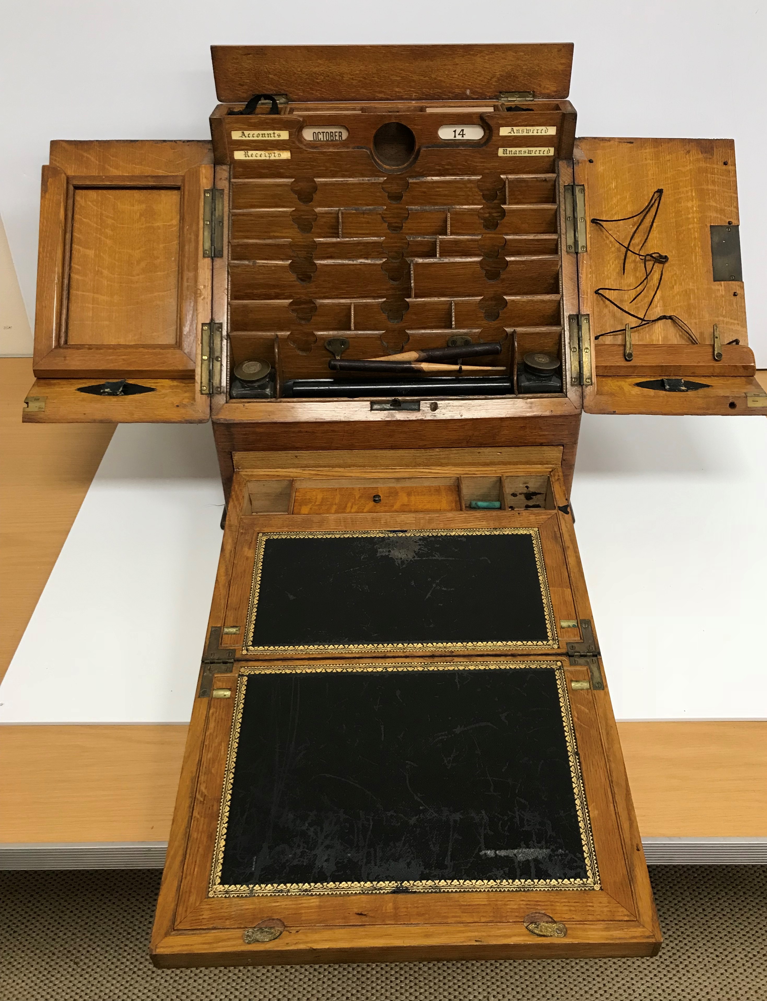 A late Victorian oak slope front stationery cabinet by Parkins & Gotto of Oxford Street, - Image 3 of 3