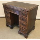 A George III mahogany kneehole writing table or desk,