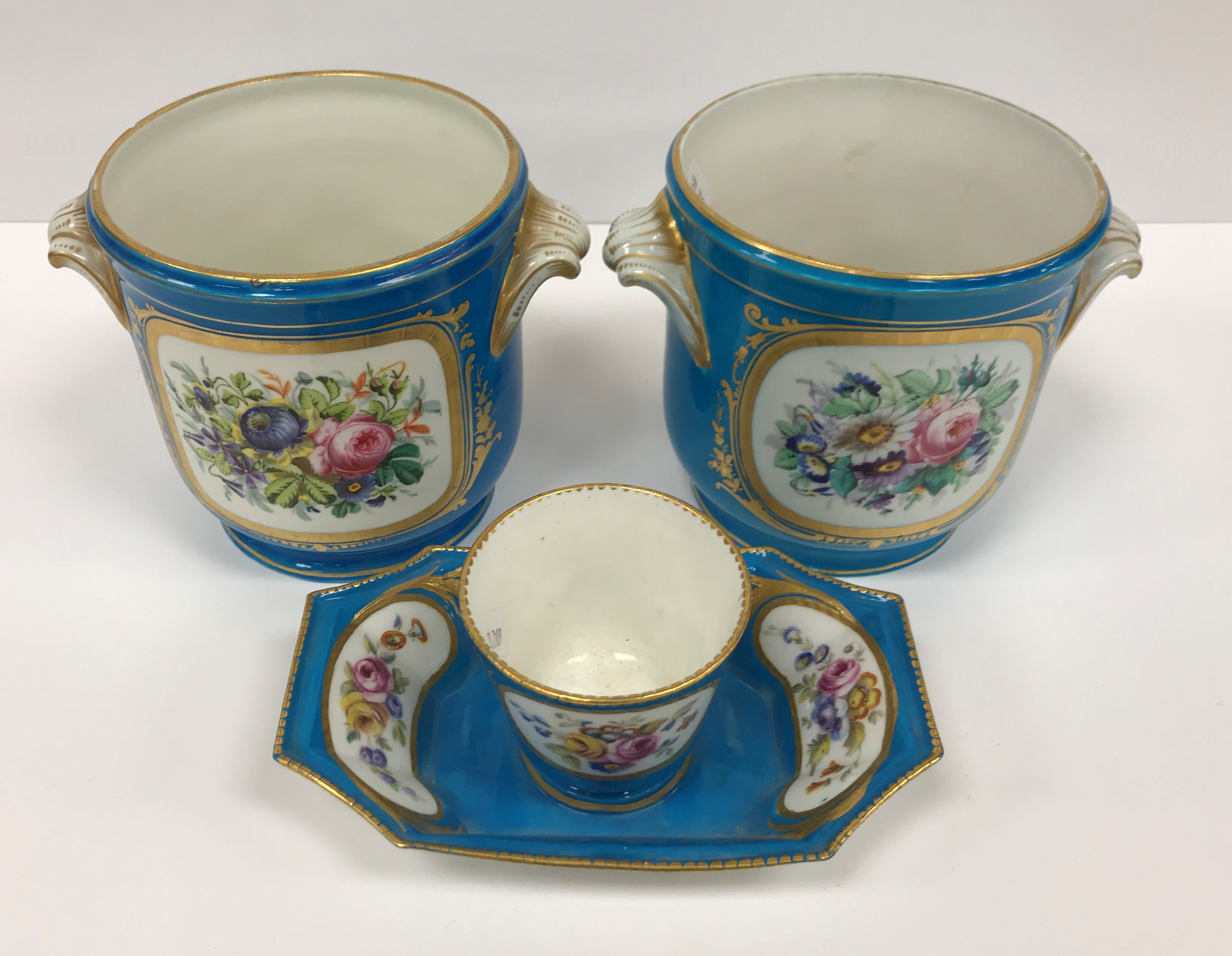 A pair of Sèvres bleu celeste and hand painted cachepots with figural and jewelled decoration the