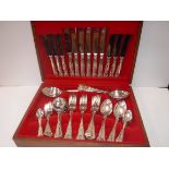 An eight place setting silver plated canteen of Kings pattern cutlery together with a collection of