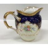 A Mintons floral spray blue and gilt decorated part tea service comprising six cups and saucers,