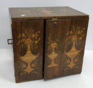 A Victorian rosewood and marquetry inlaid table top cabinet with floral and vase decoration,