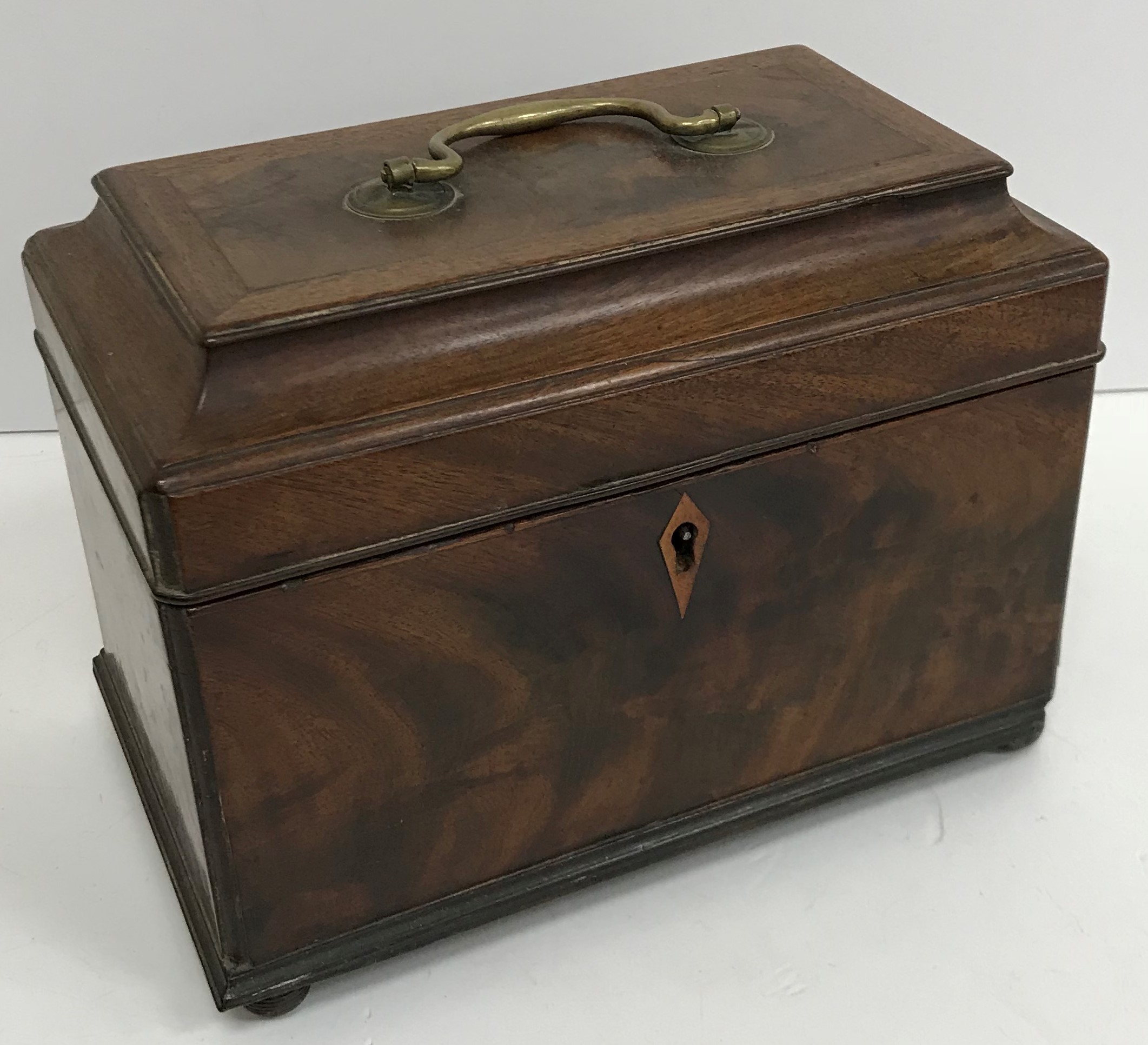 A late George III figured mahogany tea caddy,