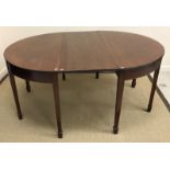 An early 19th Century mahogany D end dining table with associated modern centre leaf,