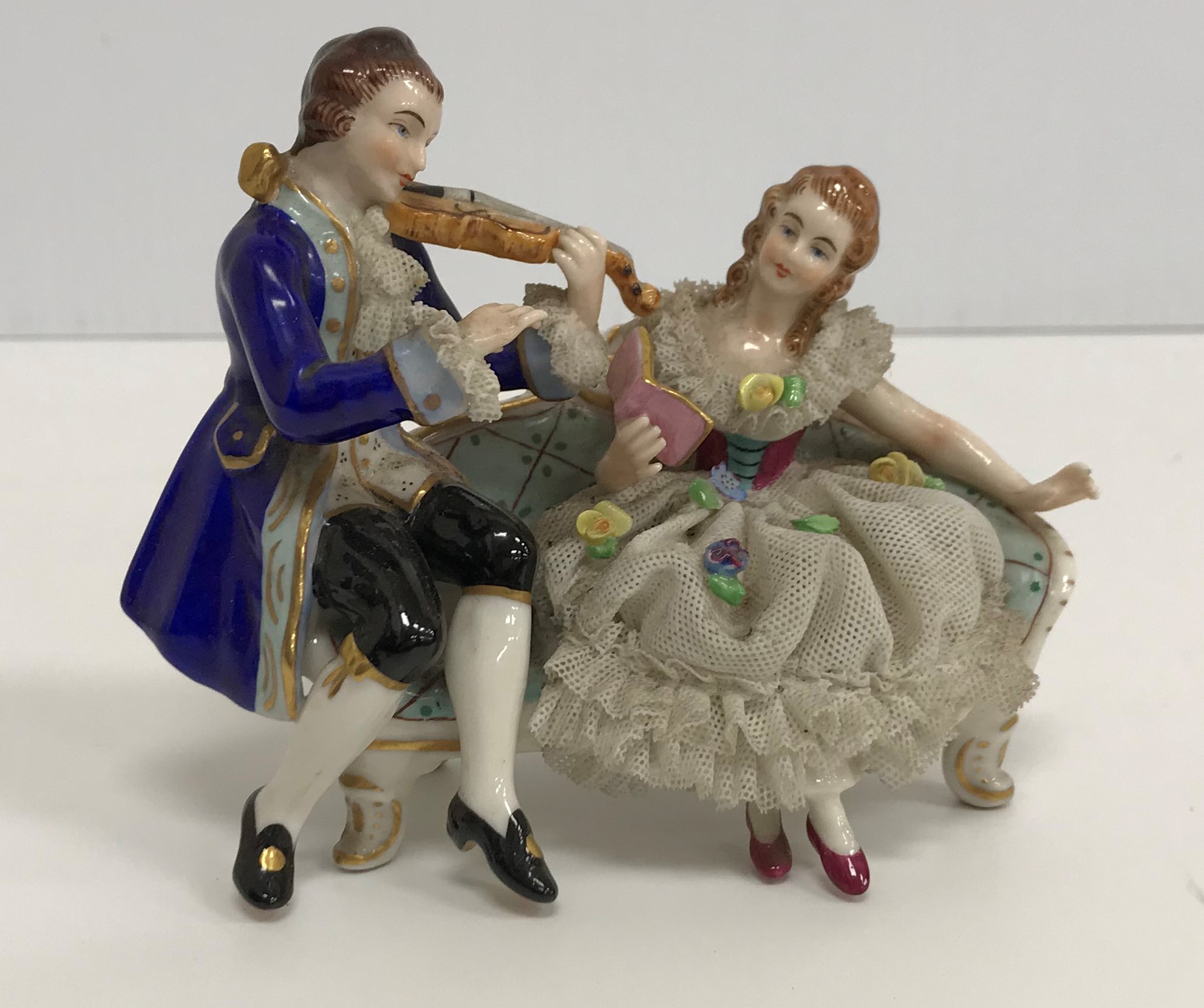 A collection of various Continental figure groups in the Meissen or Dresden manner including