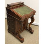 A Victorian burr walnut davenport desk of typical form with stationery compartment above a writing