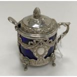 A 19th Century Continental cast silver lidded mustard with swag and bow decoration,