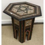 A Syrian mother of pearl and parquetry inlaid hexagonal occasional table with central star