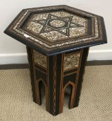 A Syrian mother of pearl and parquetry inlaid hexagonal occasional table with central star