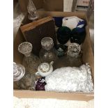 A box containing five various cut glass decanters,