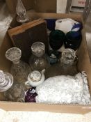 A box containing five various cut glass decanters,