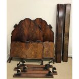 A pair of early 20th Century figured mahogany single bedsteads in the French taste by Howard and