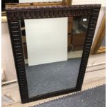 A Middle Eastern beaded framed rectangular wall mirror 41 cm x 53 cm,