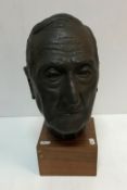 A mid 20th Century bust of a gentleman set on a square mahogany base bearing label inscribed "...