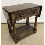 An oak single drawer drop leaf side table attributed to Titchmarsh & Goodwin,