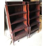 A pair of modern mahogany Regency style waterfall bookcases,